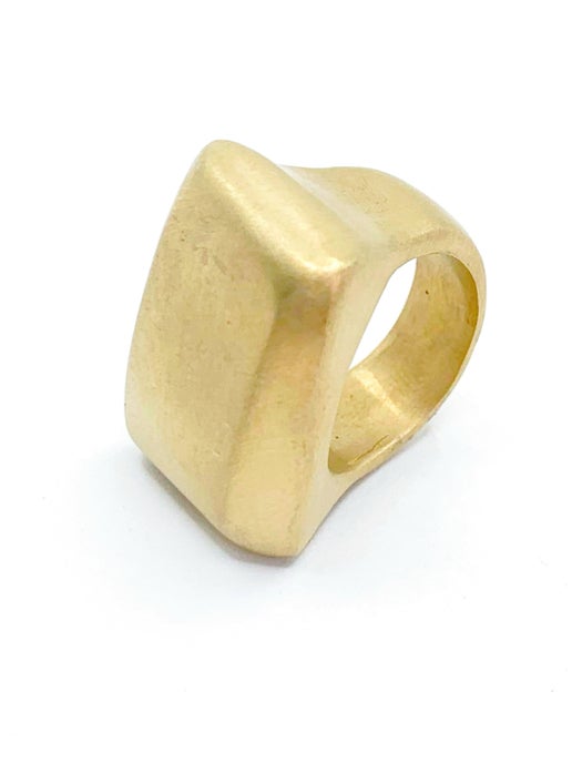 Gold ring with a square design on a white background