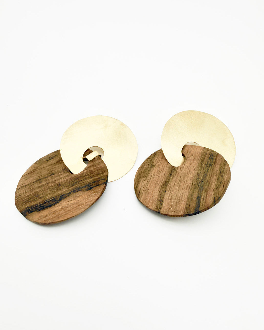 Wooden earrings with gold accents on a white background