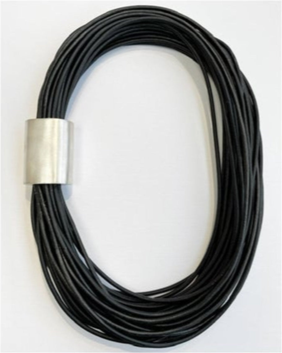 Black leather multi-strand necklace with silver detail on a white background
