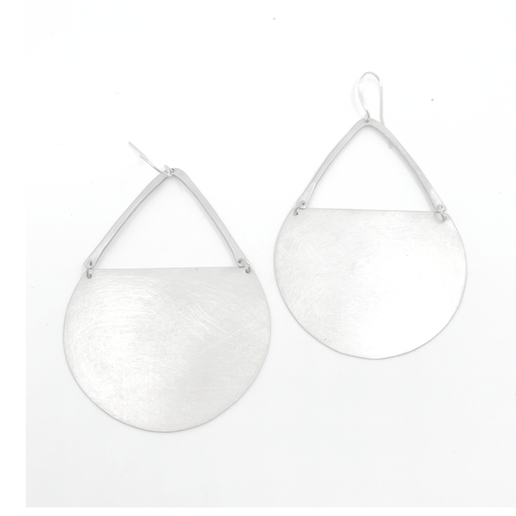Pair of silver earrings with circular detail on a white background