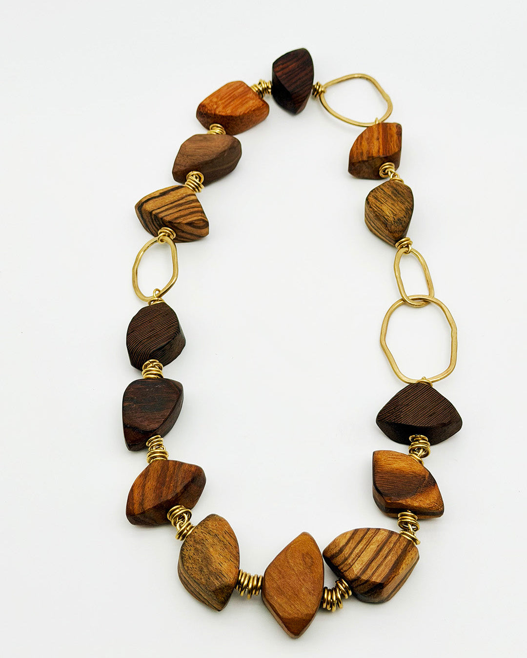 Necklace with wooden beads and gold accents on a white background