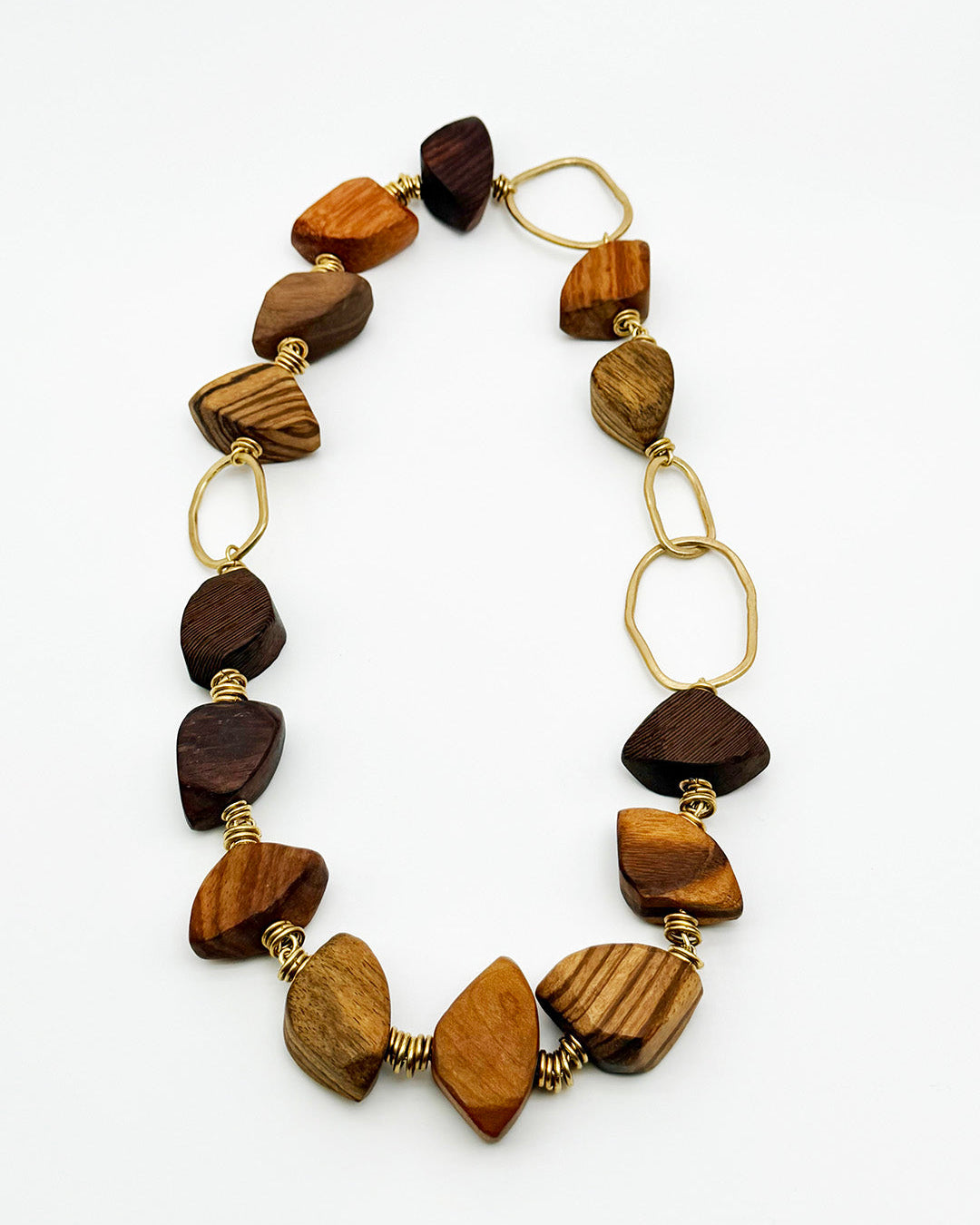 Necklace with wooden beads and gold accents on a white background