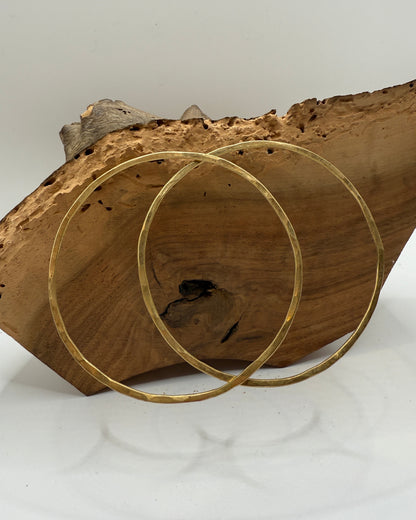 Gold circular object on a wooden surface