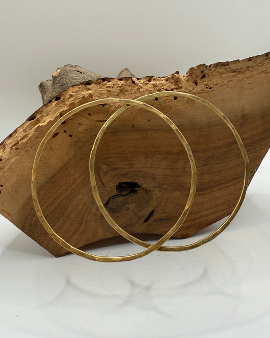 Gold circular object on a wooden surface