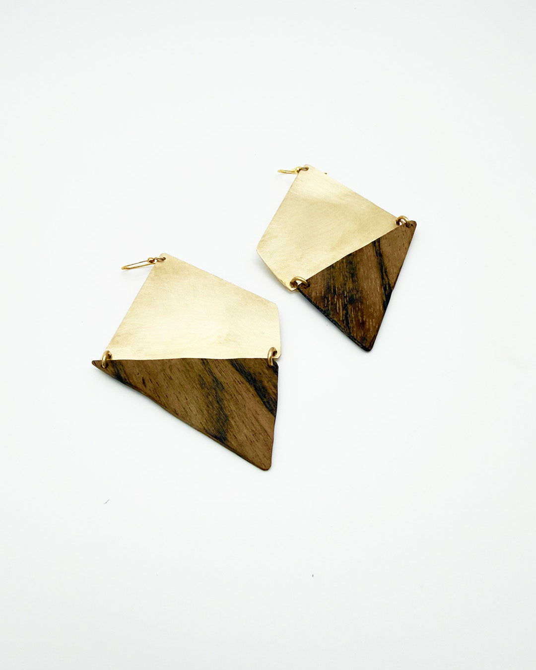 Pair of gold geometric earrings on a white background