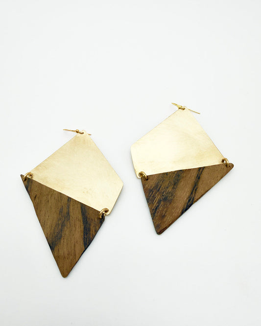 Pair of gold and wood triangle earrings on a white background