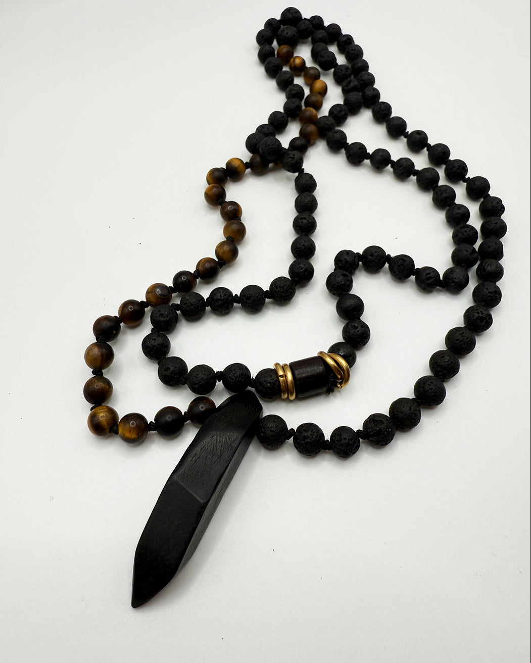 Necklace with black and brown beads on a white background