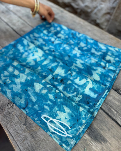 Blue patterned fabric on a wooden surface