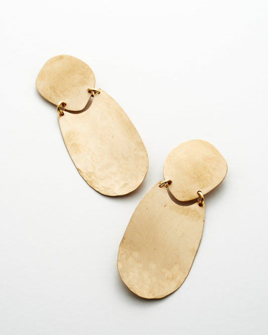 Pair of bronze earrings on a white background