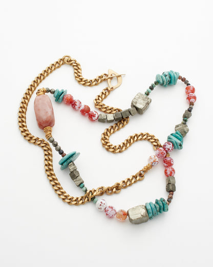 Colorful beaded necklace with gold chain on a white background