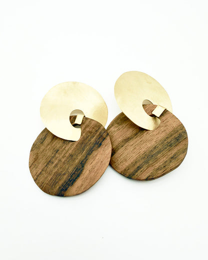 Wooden earrings with gold circular accents on a white background