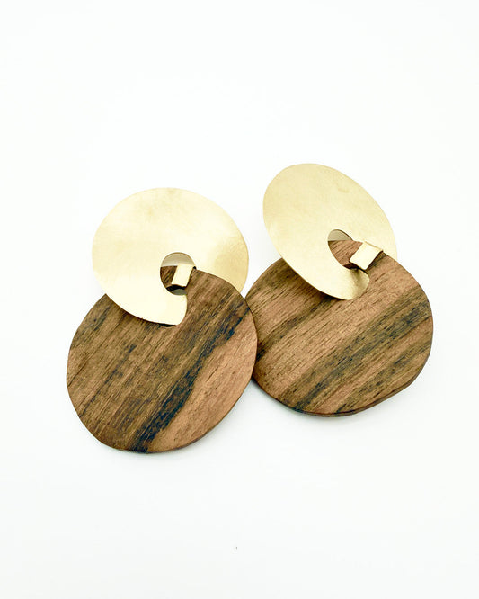 Wooden earrings with gold circular accents on a white background