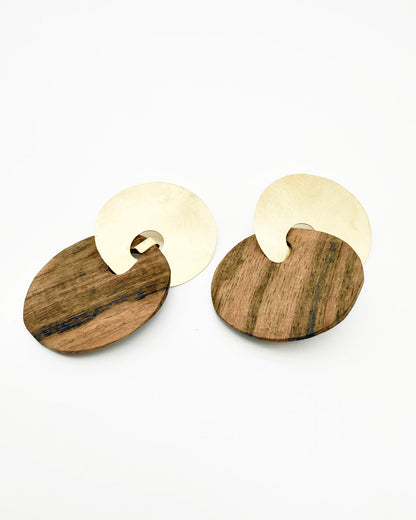 Wooden earrings with gold accents on a white background