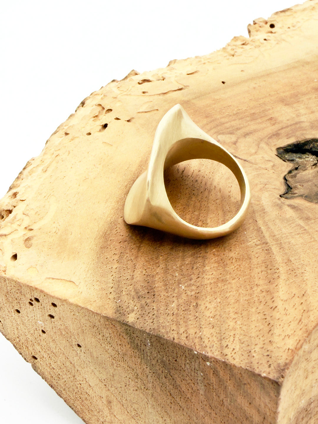 Beige ring on a wooden surface