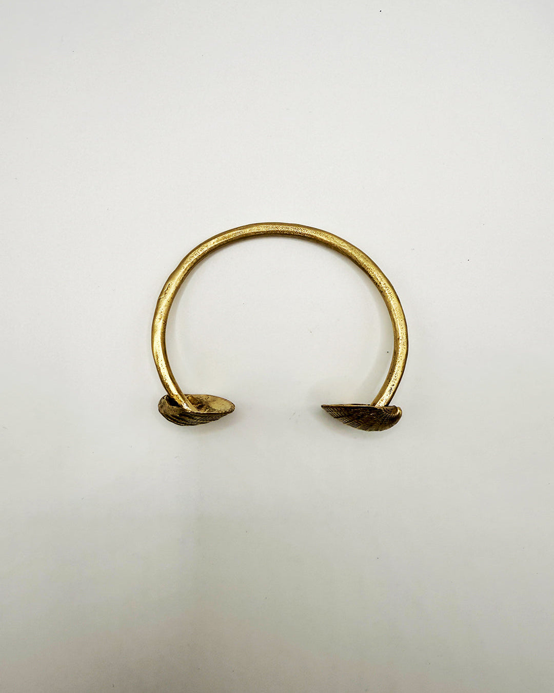 Gold bracelet on a white background