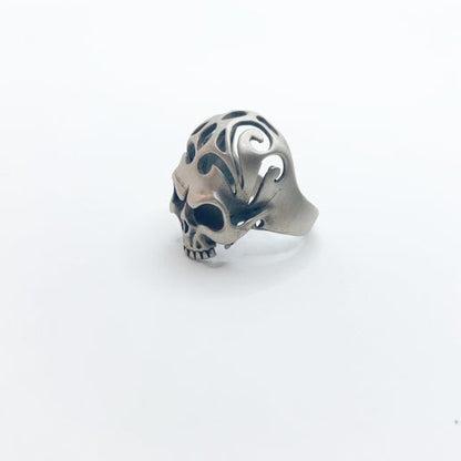 Silver skull ring on a white background