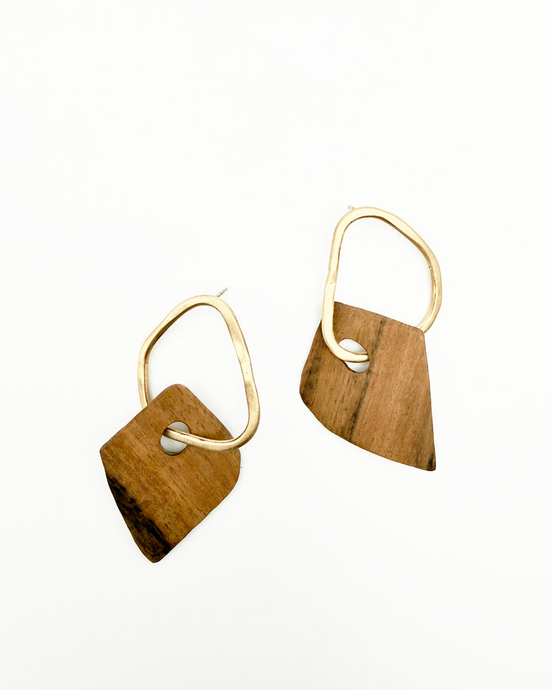 Wooden earrings with gold hooks on a white background