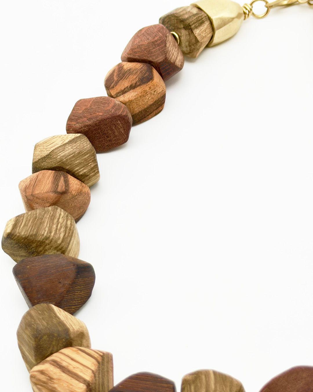 Wooden beaded necklace with a gold clasp on a white background