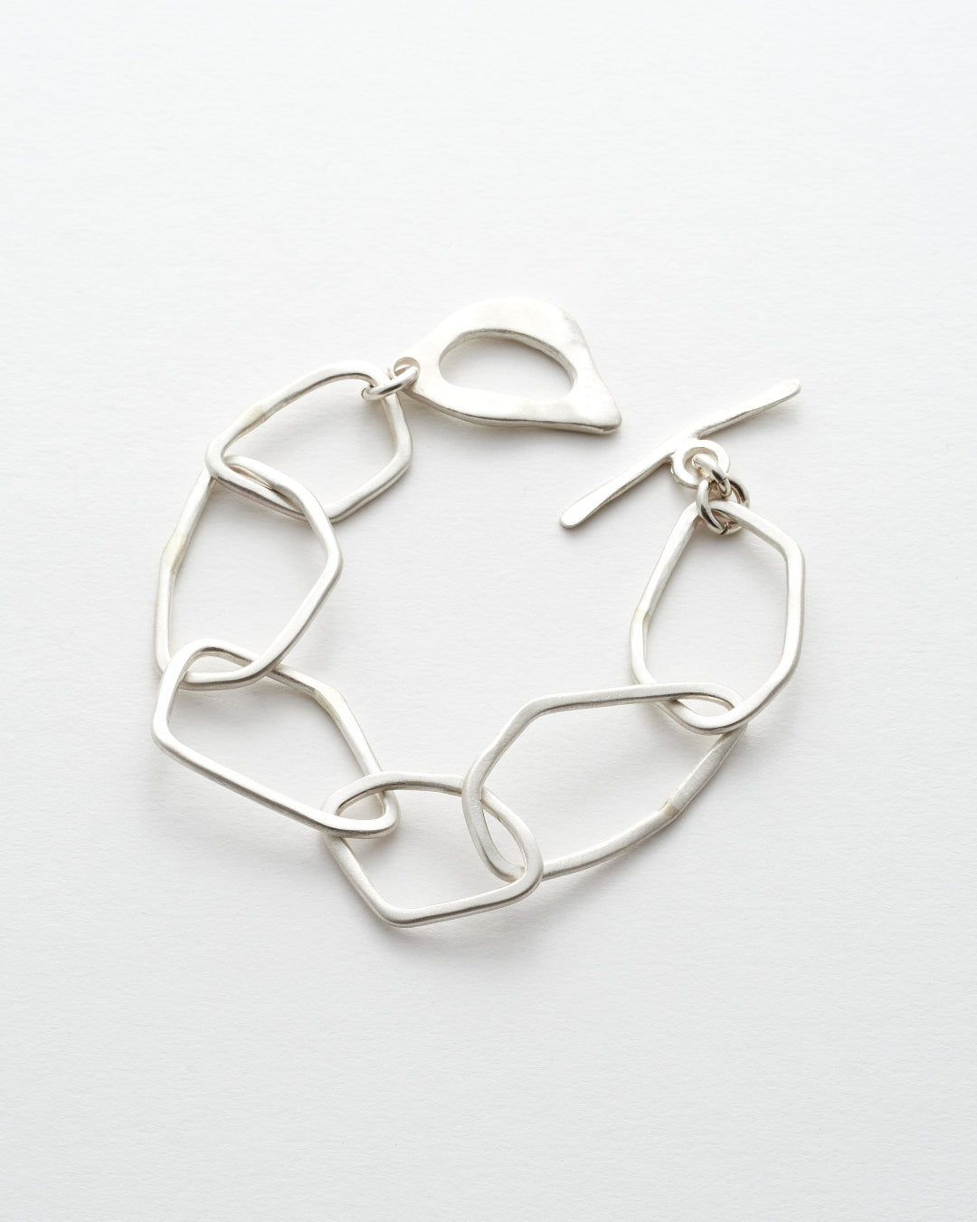 Silver link bracelet on a white background