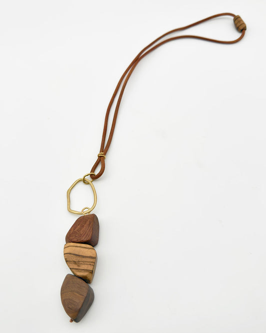 Wooden pendant necklace on a white background