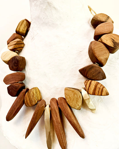 Necklace made of wooden beads on a white background