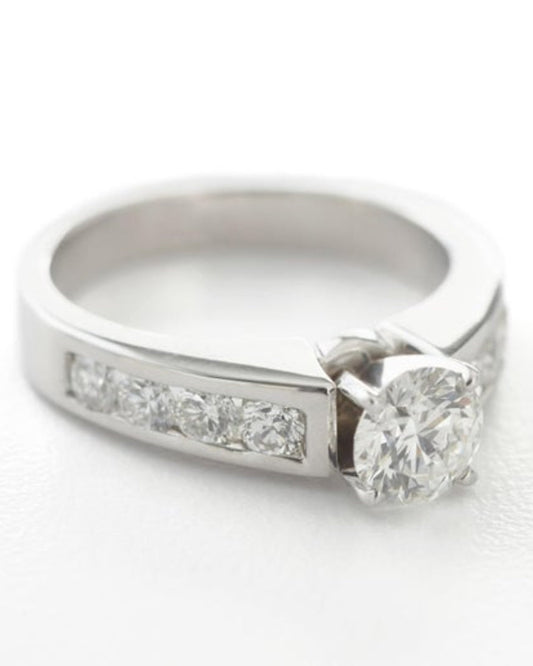 Silver ring with diamonds on a white background