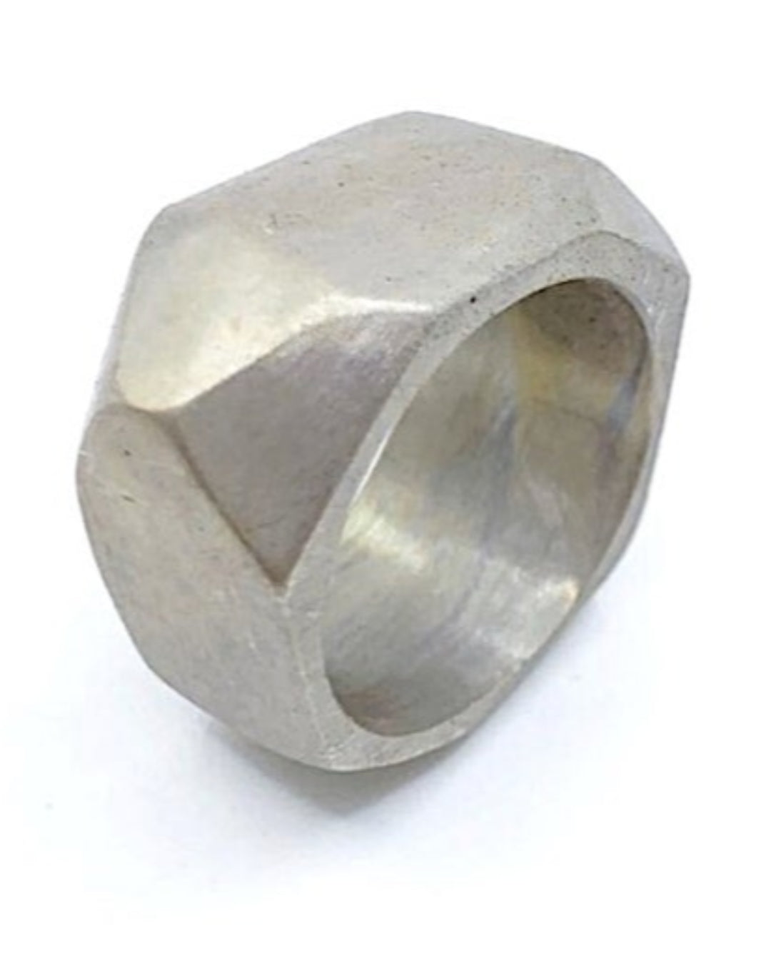 Silver ring with geometric design on a white background