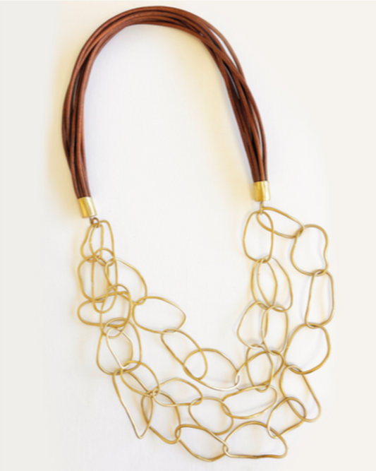 Necklace featuring a multi-strand leather neck loop and open circle pendants