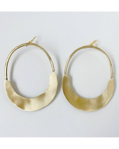 Gold hoop earrings on a white background