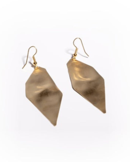 Textured gold earrings on a white background