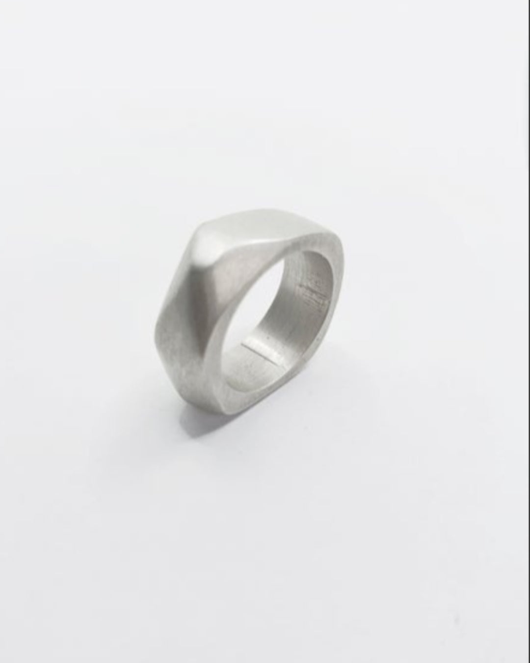 Silver ring on a white background