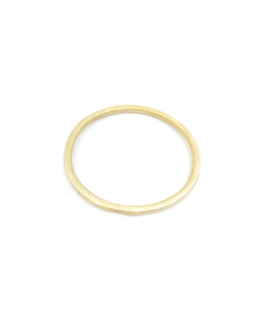 Modern gold bangle on a white background
