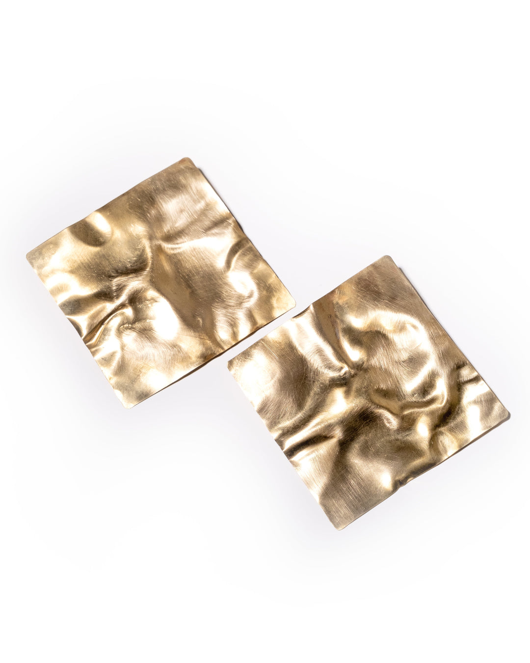 Pair of textured gold square earrings on a white background