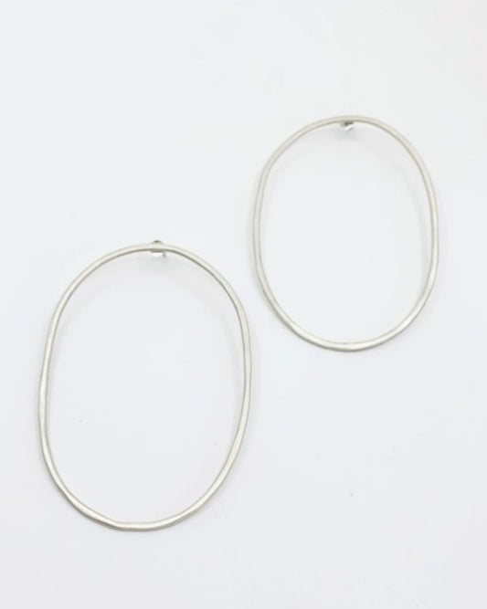 Pair of silver hoop earrings on a white background