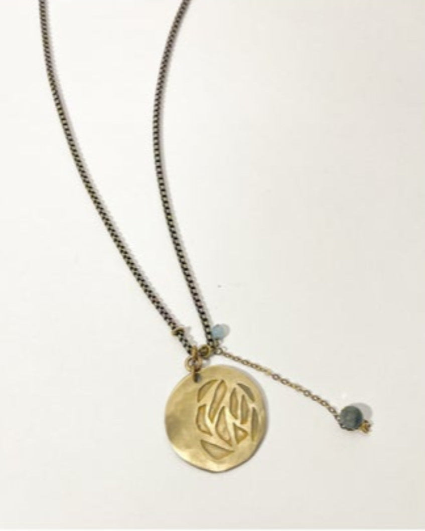 Necklace with a gold pendant on a white background