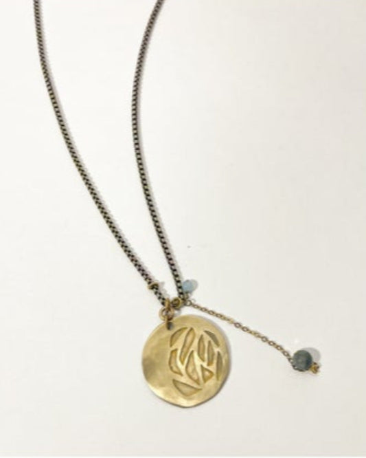 Necklace with a gold pendant on a white background