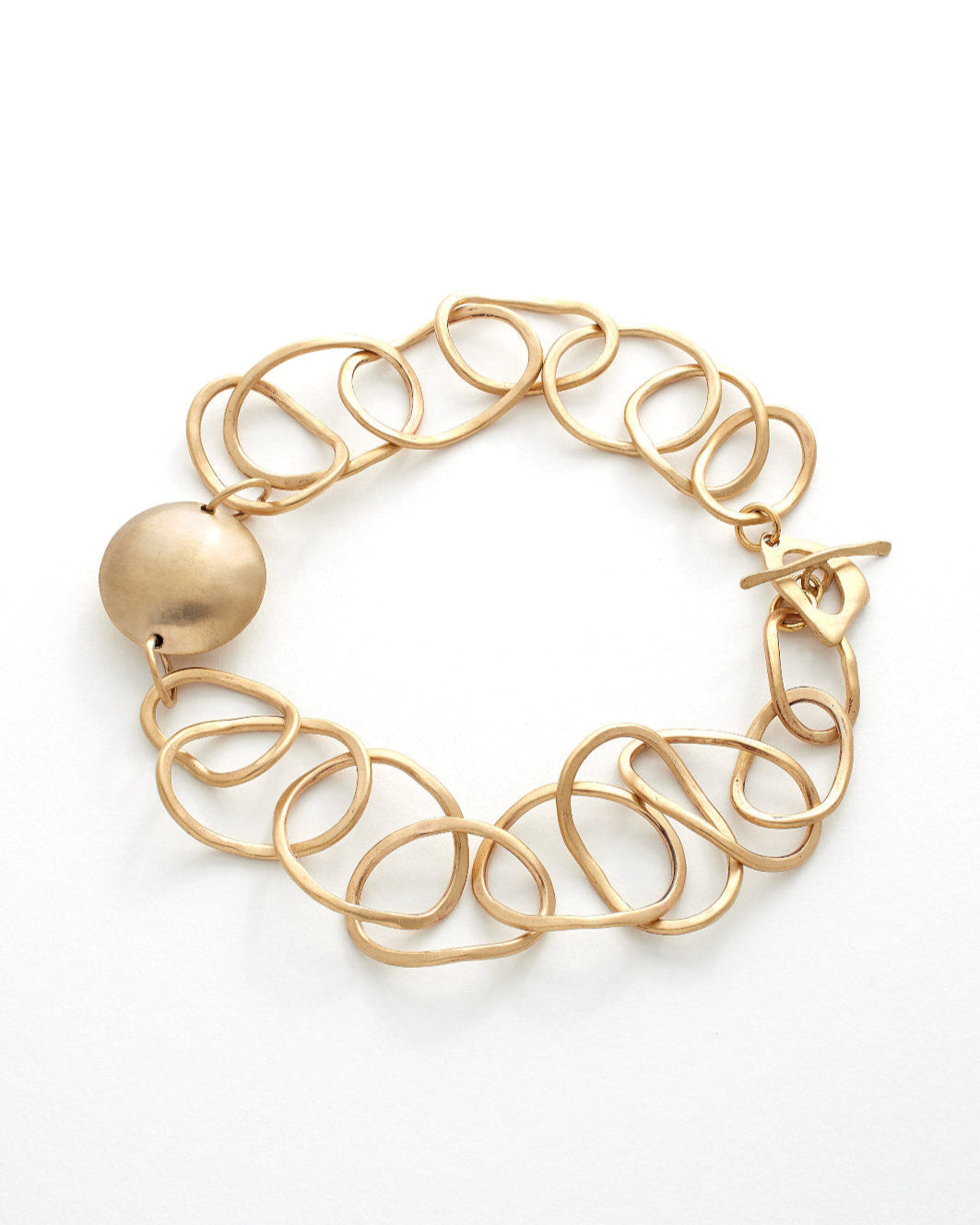 Gold link necklace with a solid round charm on a white background