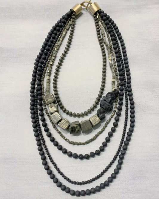 Multi-strand beaded necklace with black and gray beads on a white background