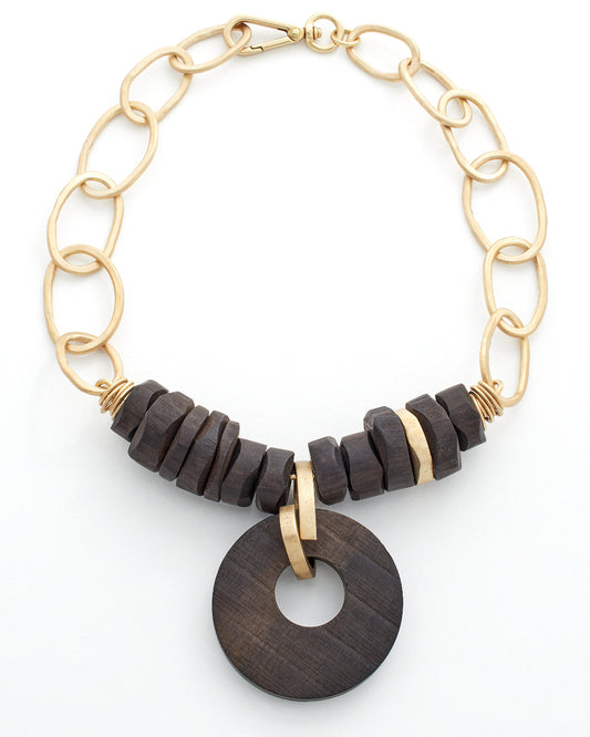 Gold link necklace with gold and dark wood beads on a white background