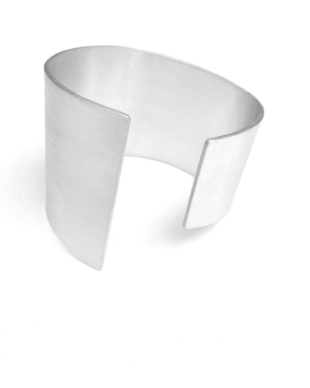 Silver cuff with geometric design on a white background